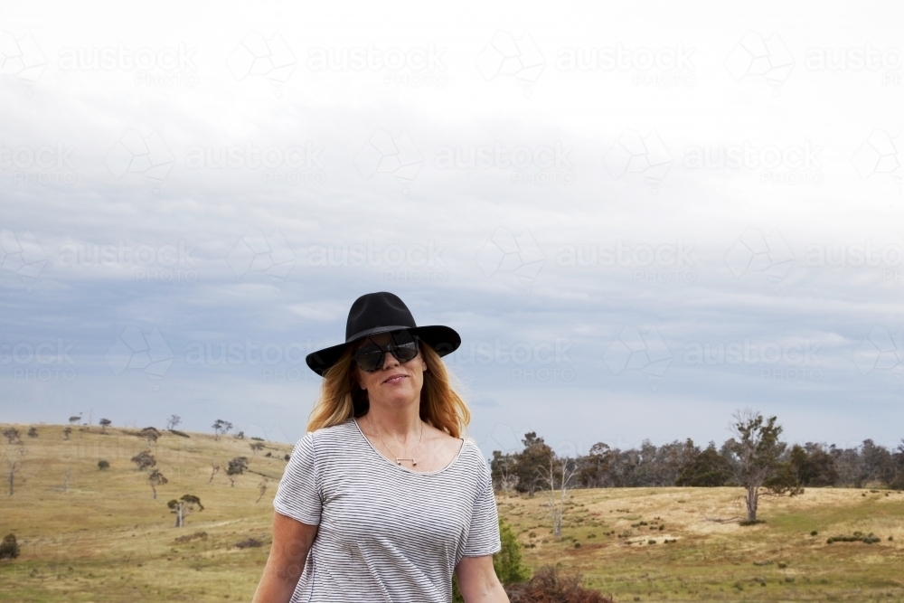 Woman walking on a farm - Australian Stock Image