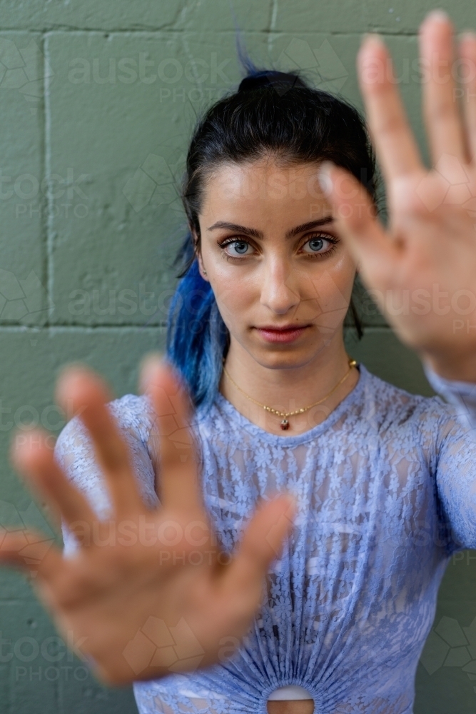 woman with hands in front of face - Australian Stock Image