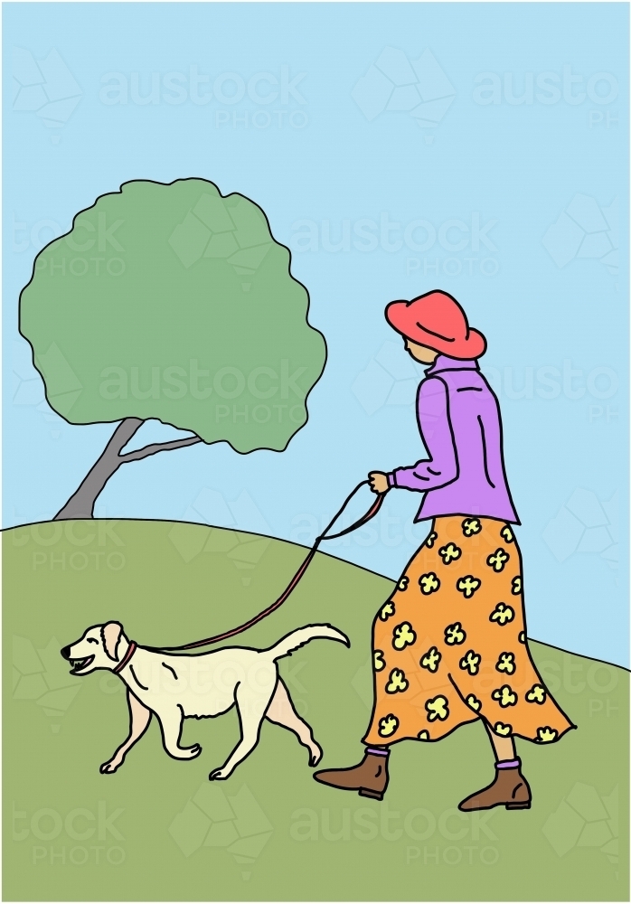 Woman with orange skirt, purple jacket, red hat, walking yellow dog up green hill with tree - Australian Stock Image