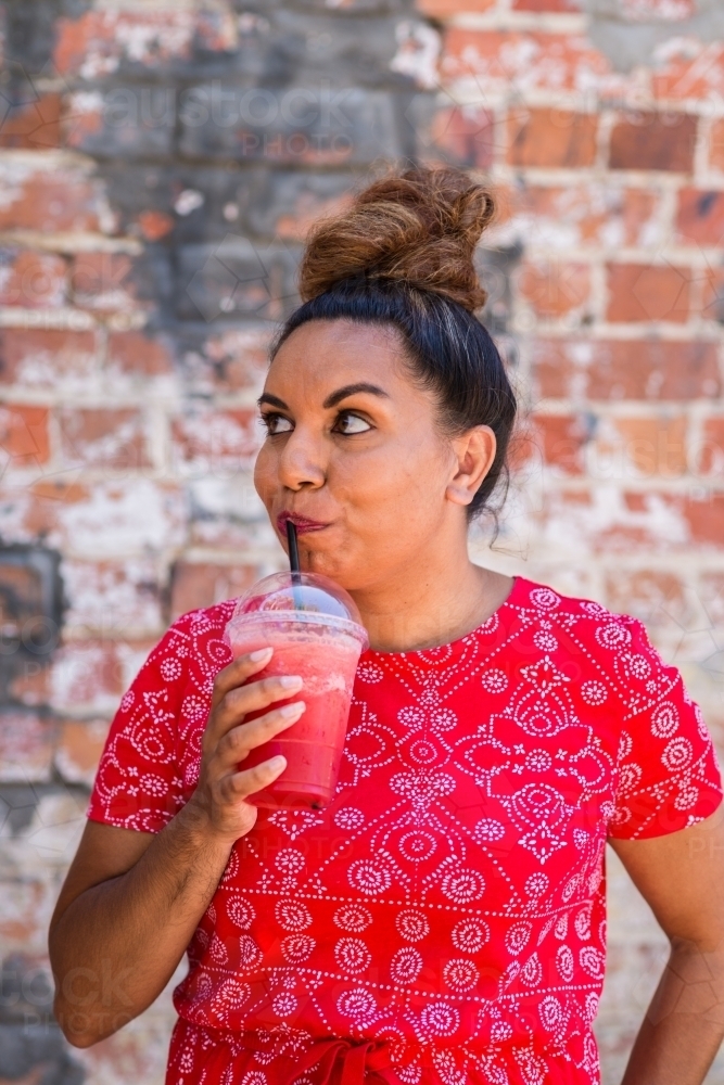 woman with watermelon smoothie - Australian Stock Image