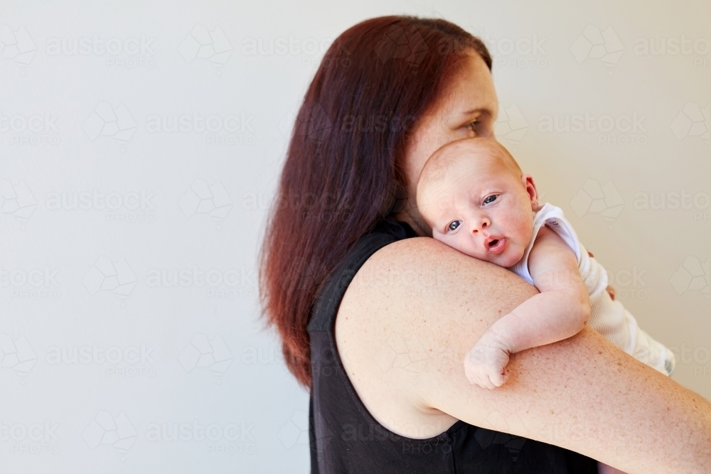 Image of Women holding newborn baby - Austockphoto