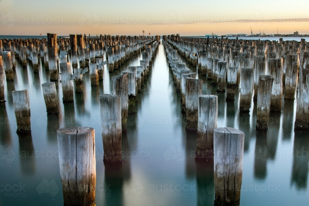 Wooden posts left behind in water at pier at Port Melbourne - Australian Stock Image