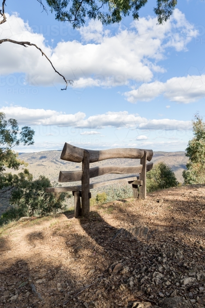 Wooden seat and mountain landscape - Australian Stock Image