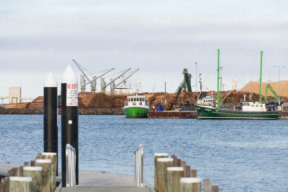 Working port and machinery with jetty in foreground - Australian Stock Image