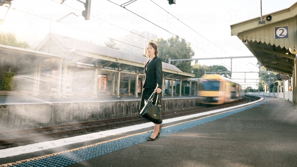 Working woman at train station - Australian Stock Image