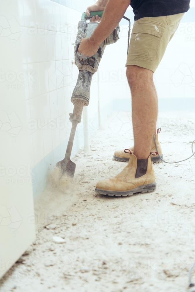 Workman jackhammering on construction site - Australian Stock Image