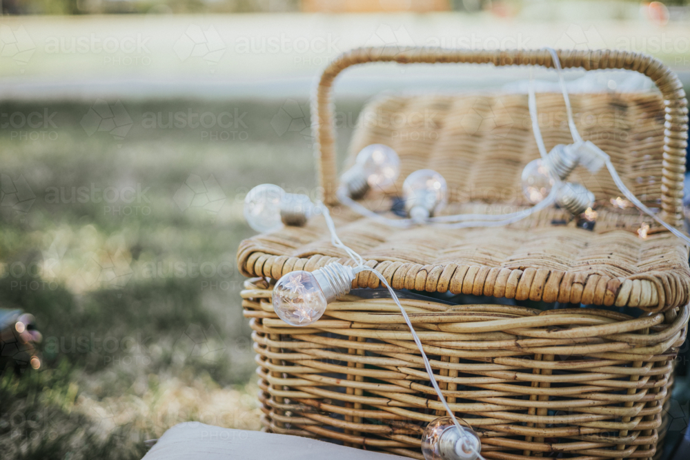 Woven Rattan picnic basket with fairy lights - Australian Stock Image