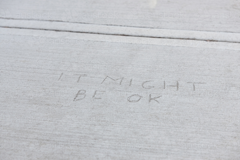Written message in concrete pavement - Australian Stock Image