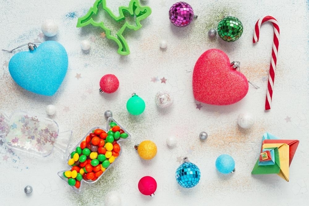 xmas flat lay with glitter and lollies and small baubles - Australian Stock Image