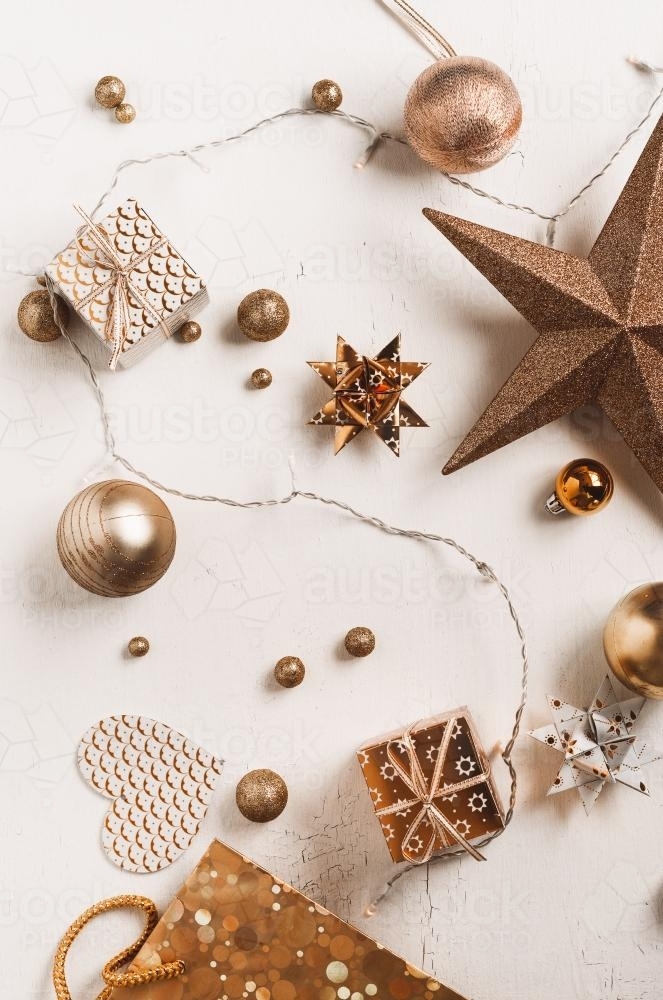 xmas flatlay with bronze or copper coloured ornaments - Australian Stock Image