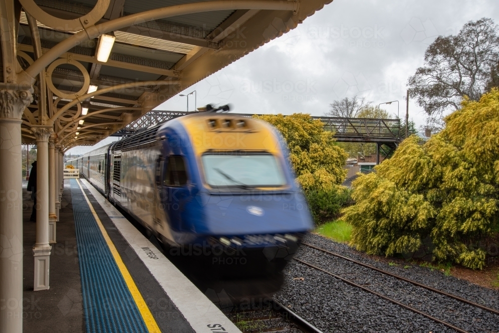XPT train arriving at platform - Australian Stock Image
