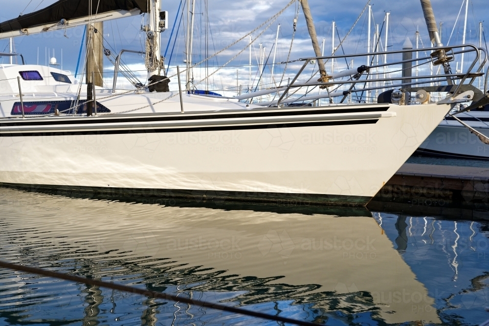 Yacht sail boat anchored at Hervey Bay Marina in tranquil waters - Australian Stock Image
