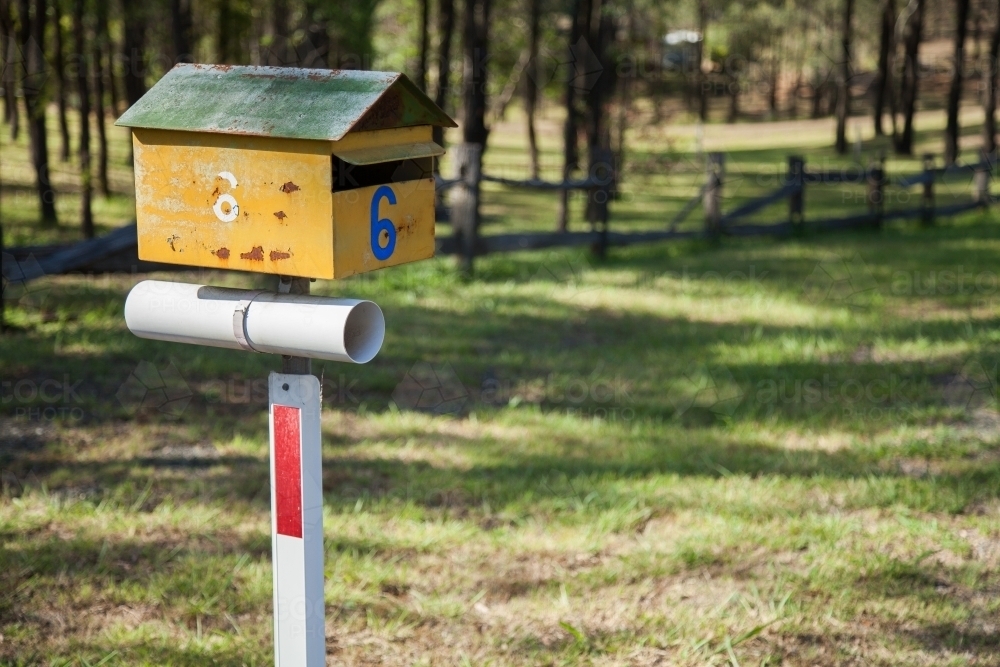 Yellow and green number six rural mailbox - Australian Stock Image