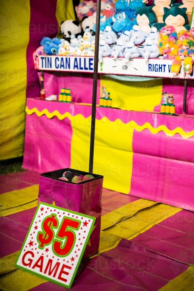 yellow and pink carnival game tent with prizes - Australian Stock Image
