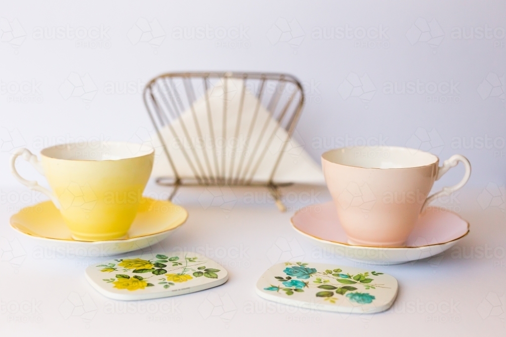 Yellow and pink vintage tea cups - Australian Stock Image