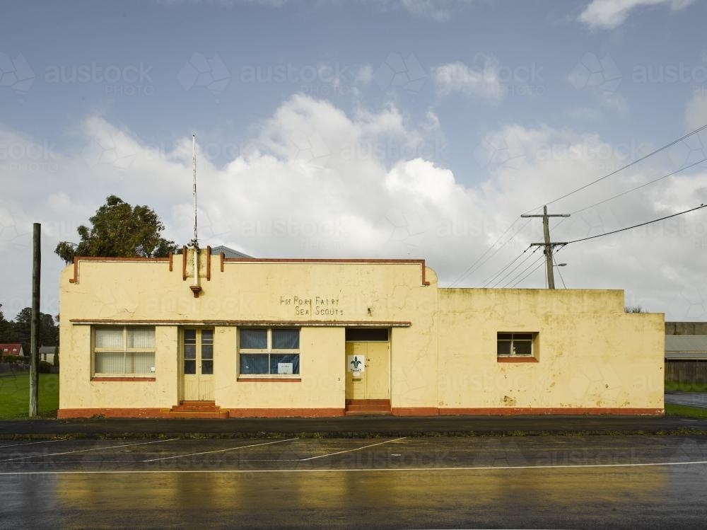 Yellow heritage buildings reflected on street - Australian Stock Image