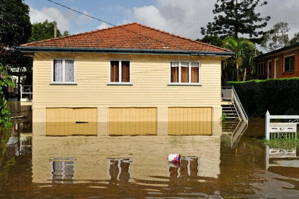 Yellow house underwater in the 2011 Floods in Brisbane - Australian Stock Image