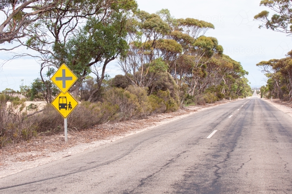 Image of Yellow school bus sign on long rural road - Austockphoto