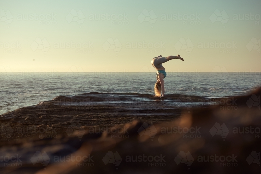 Yoga woman ocean - Australian Stock Image