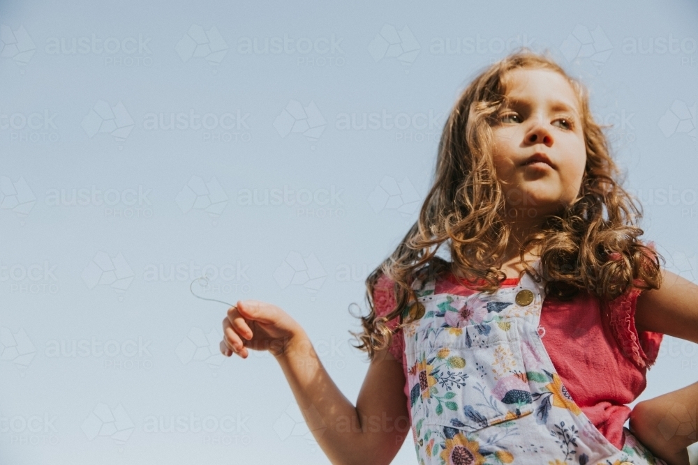 You girl posing with attitude looking away from the camera - Australian Stock Image