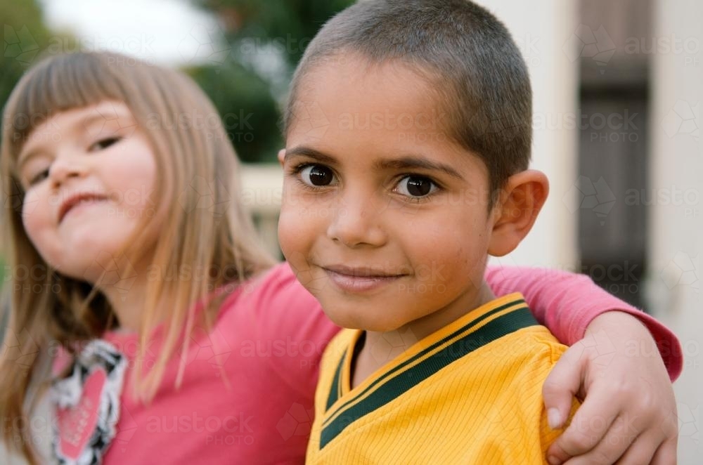 Young Aboriginal Boy and Caucasian Girl - Australian Stock Image