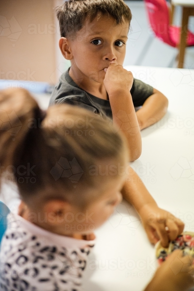 Young Aboriginal girl and boy at preschool - Australian Stock Image