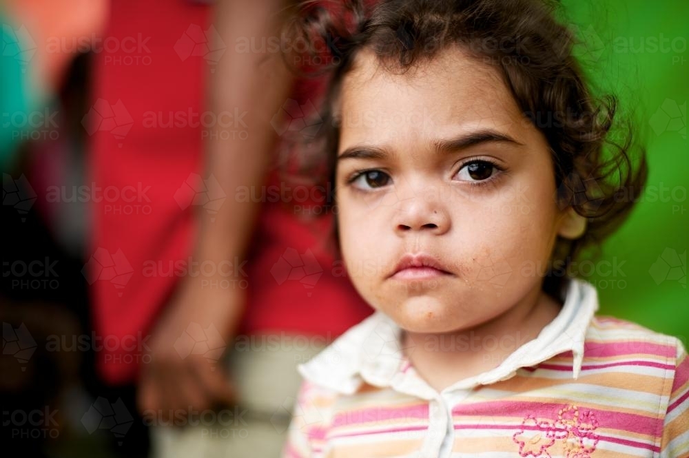 Young Aboriginal Girl Looking at Camera - Australian Stock Image