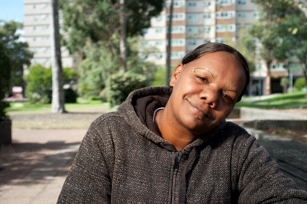 Young Aboriginal Woman in a Housing Estate - Australian Stock Image