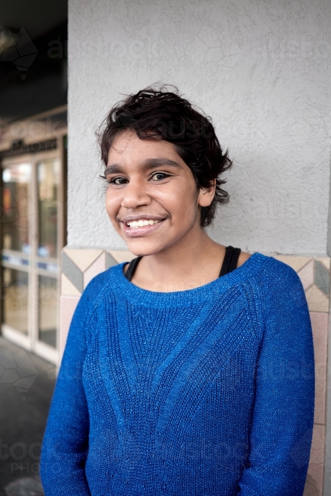 Young Aboriginal Woman Looking at Viewer - Australian Stock Image