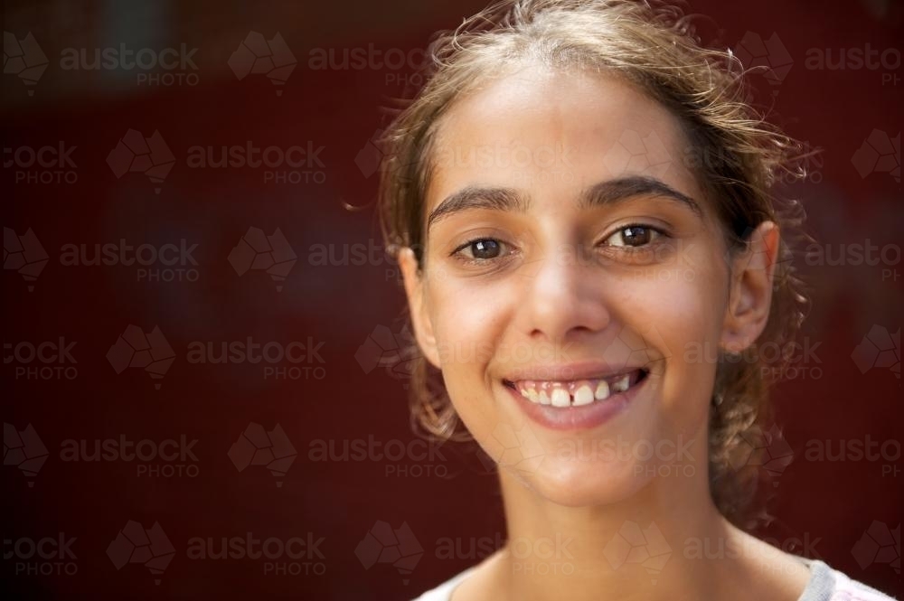 Young Aboriginal Woman Smiling Broadly - Australian Stock Image