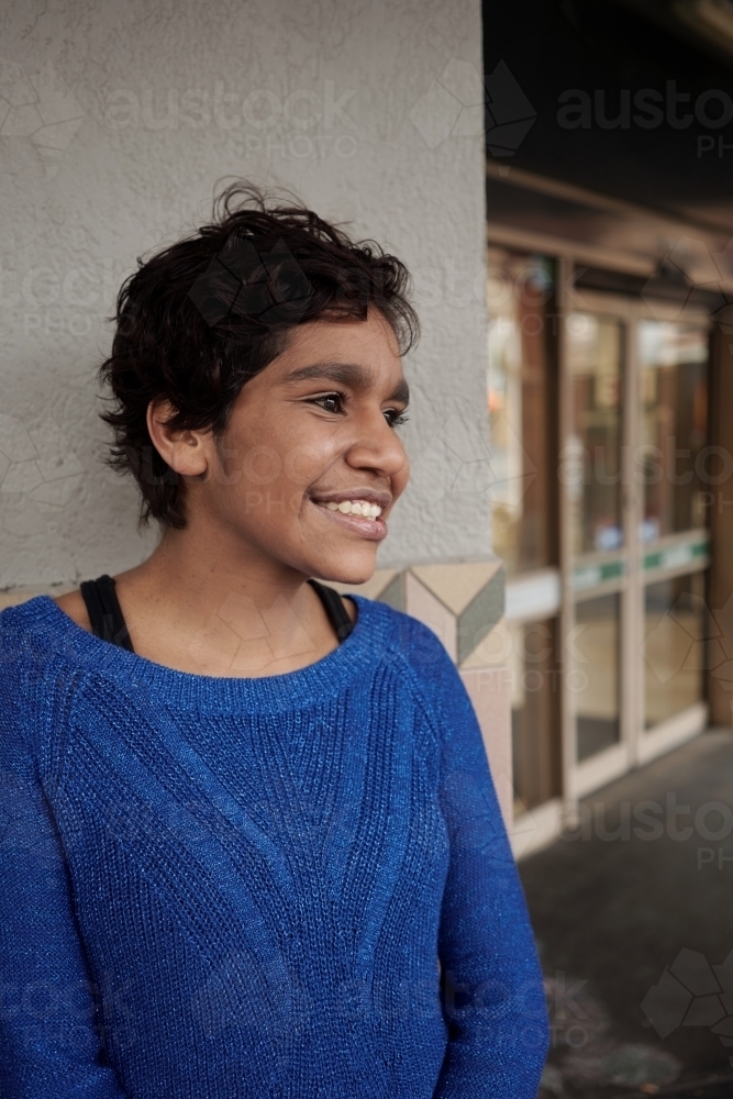 Young Aboriginal Woman with Blue Top - Australian Stock Image
