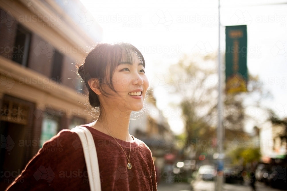 Young adult asian woman exploring the inner west urban streets of Sydney - Australian Stock Image