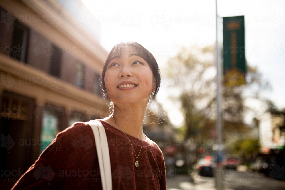 Young adult asian woman exploring the inner west urban streets of Sydney - Australian Stock Image