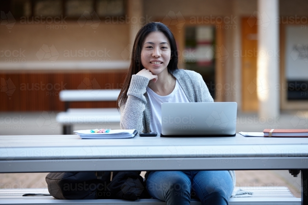 Image of Young Asian female university student studying on laptop ...