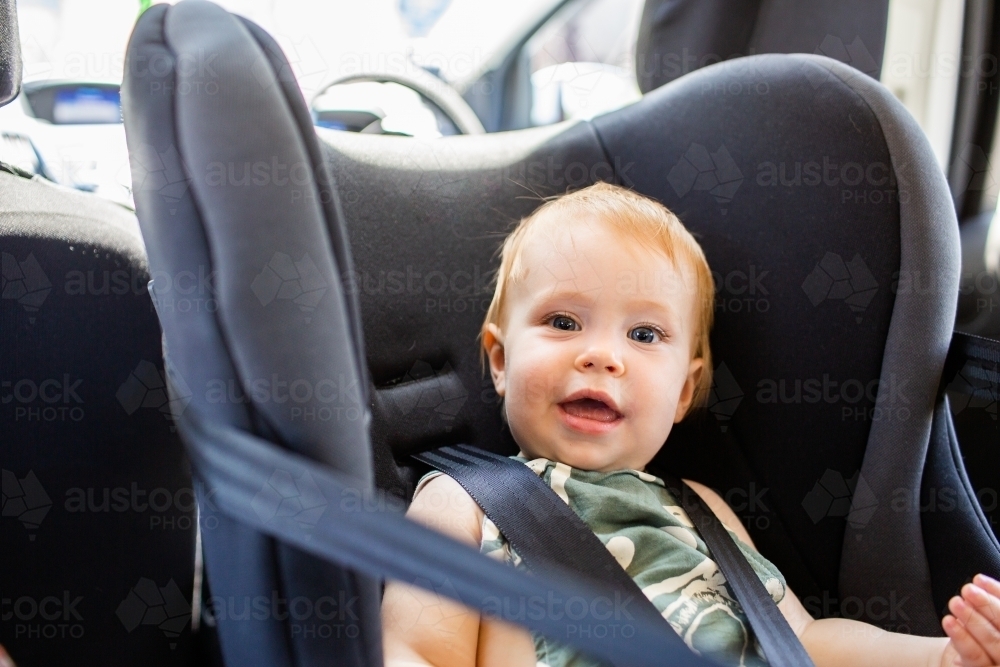 Image of Young australian baby in rear facing car sear Austockphoto