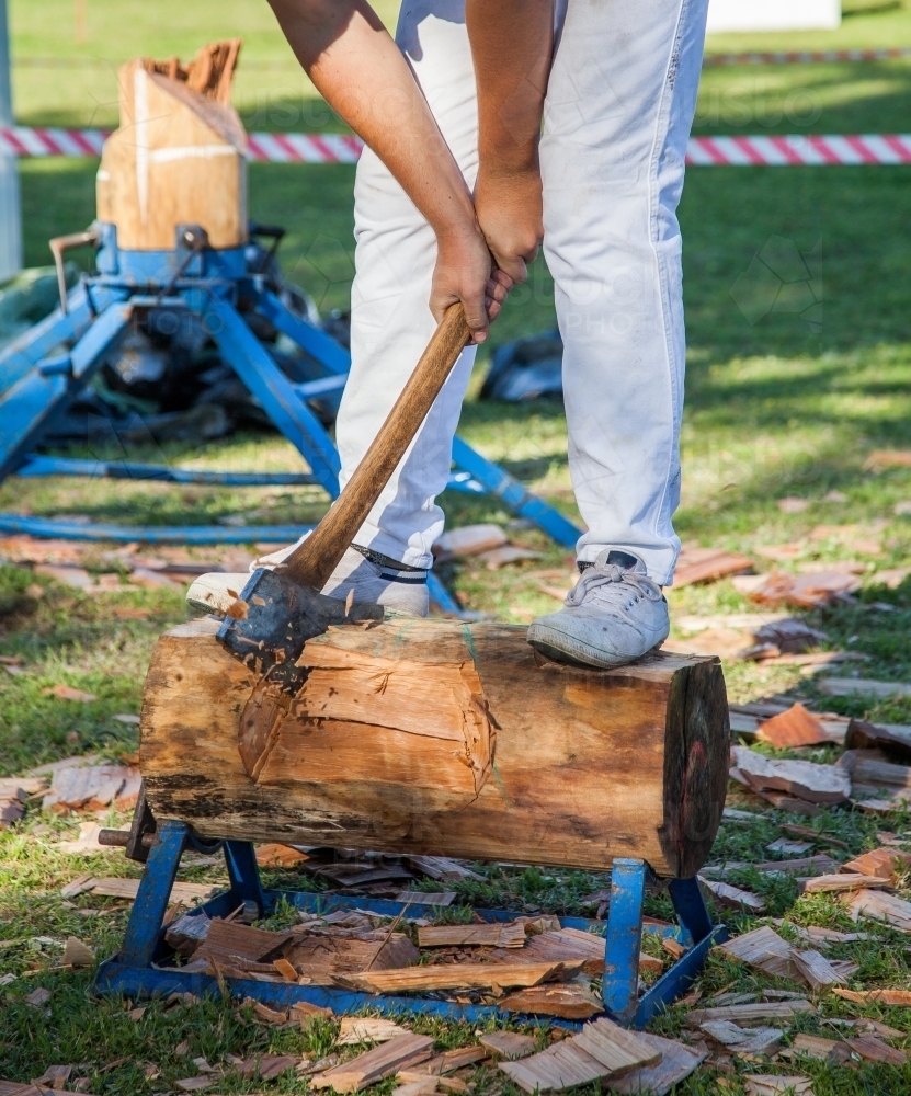 Young axeman competing in a woodchop competition - Australian Stock Image