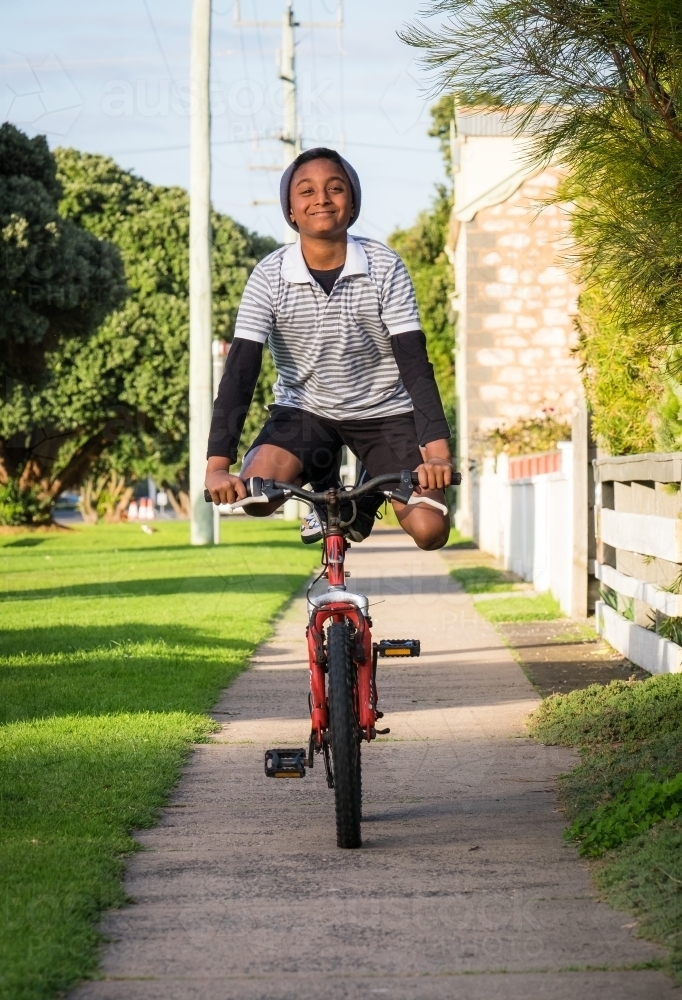 Young bike rider showing off - Australian Stock Image