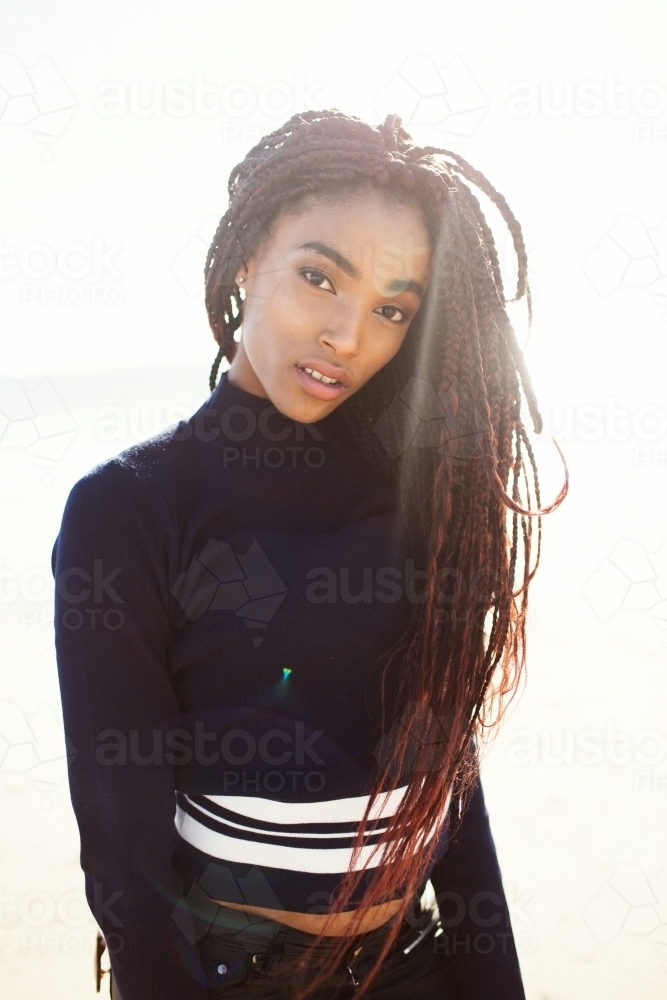 Young black woman posing on the beach - Australian Stock Image