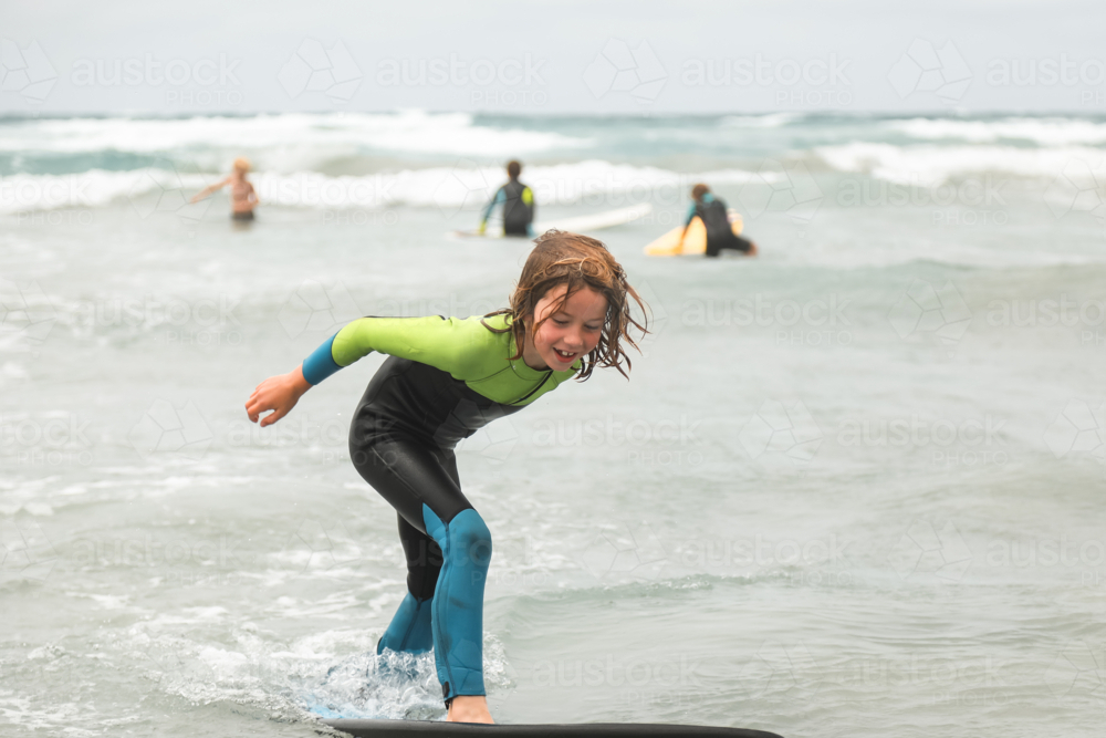 Young boy learning to surf in Portland Victoria - Australian Stock Image