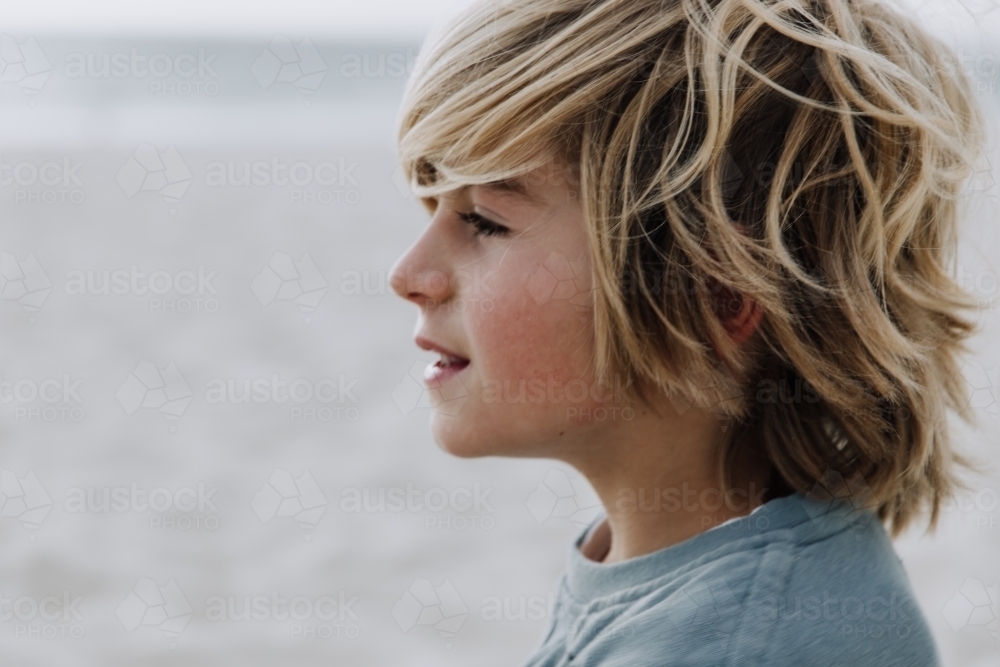 Young boy looking at ocean - Australian Stock Image