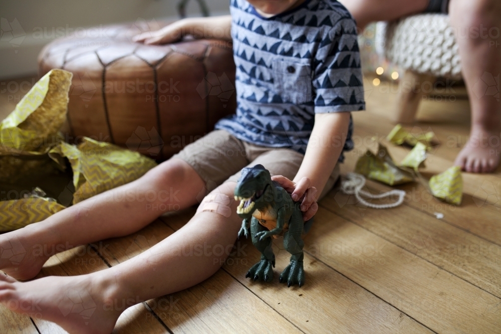 Young boy playing with new toy on Christmas day - Australian Stock Image