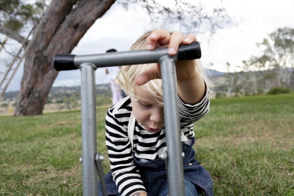 Young boy role playing outside - Australian Stock Image