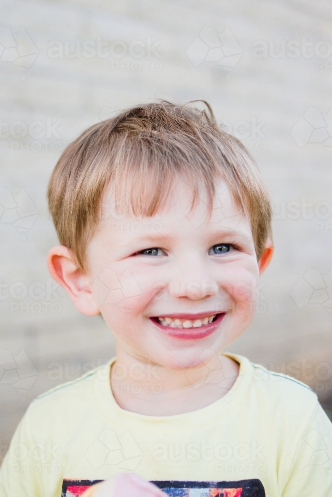 Young boy smiling - Australian Stock Image