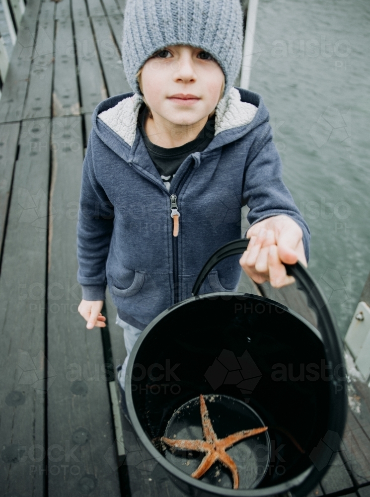 Young boys discover Starfish - Australian Stock Image