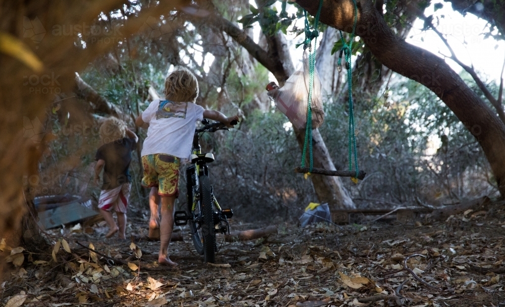 Young boys exploring in bush - Australian Stock Image