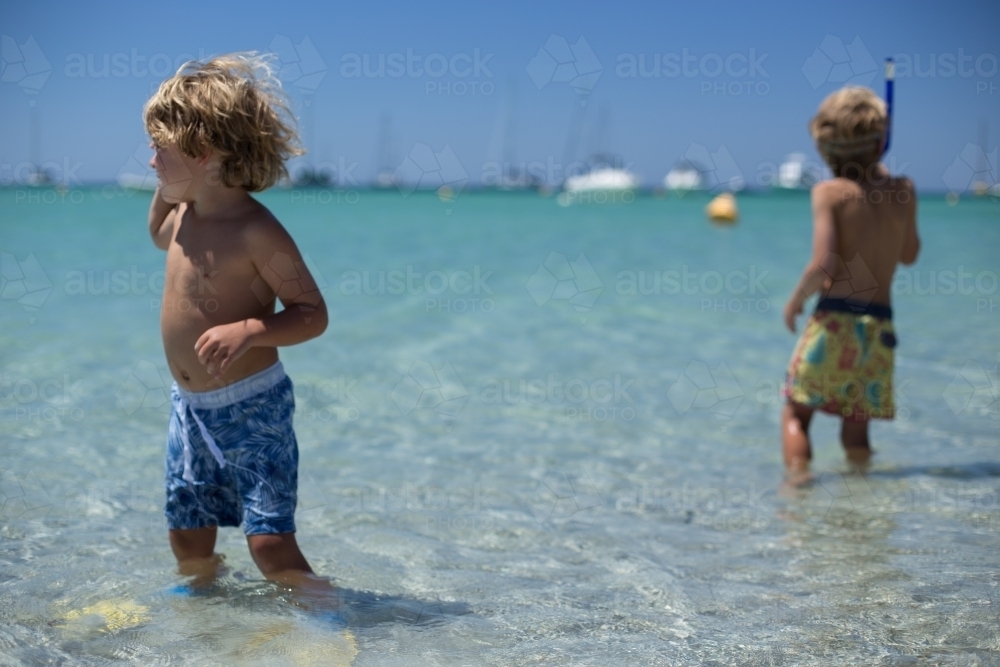 Young boys playing at beach - Australian Stock Image