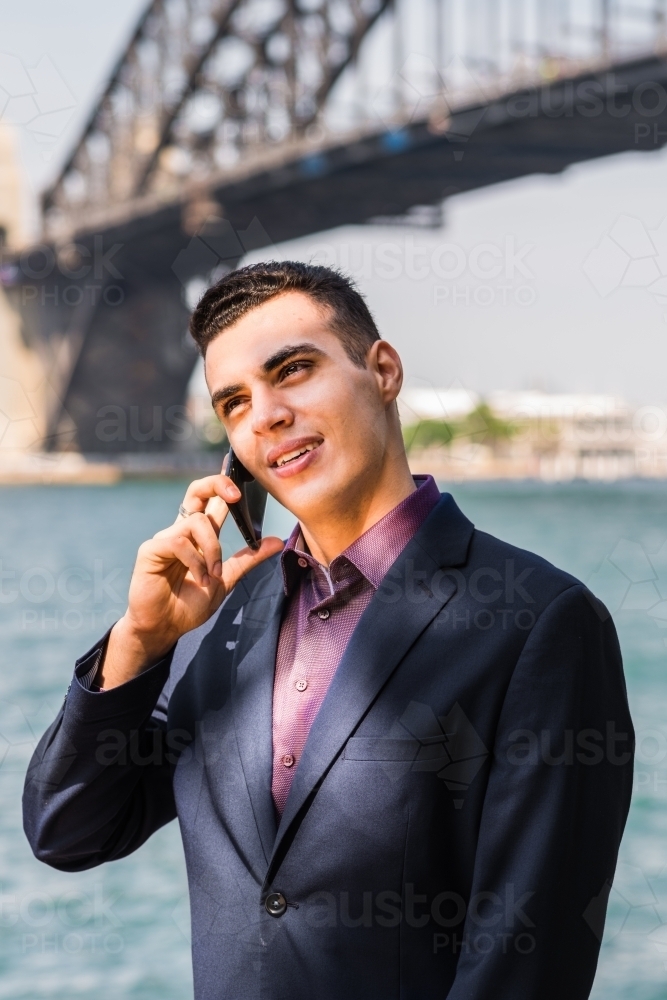 young businessman on phone - Australian Stock Image