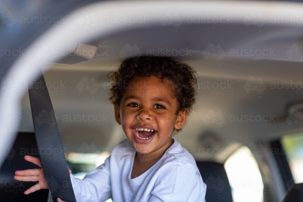 young child playing inside a van - Australian Stock Image