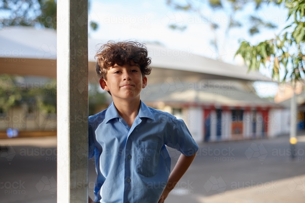 Young confident school boy at school grounds - Australian Stock Image