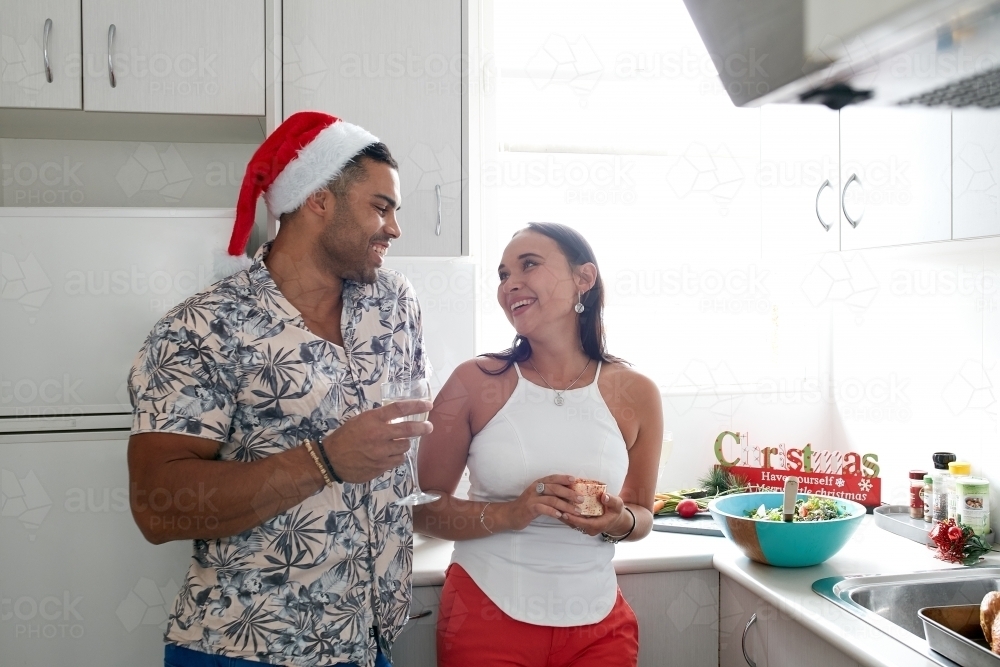 Young couple celebrating Christmas lunch together - Australian Stock Image
